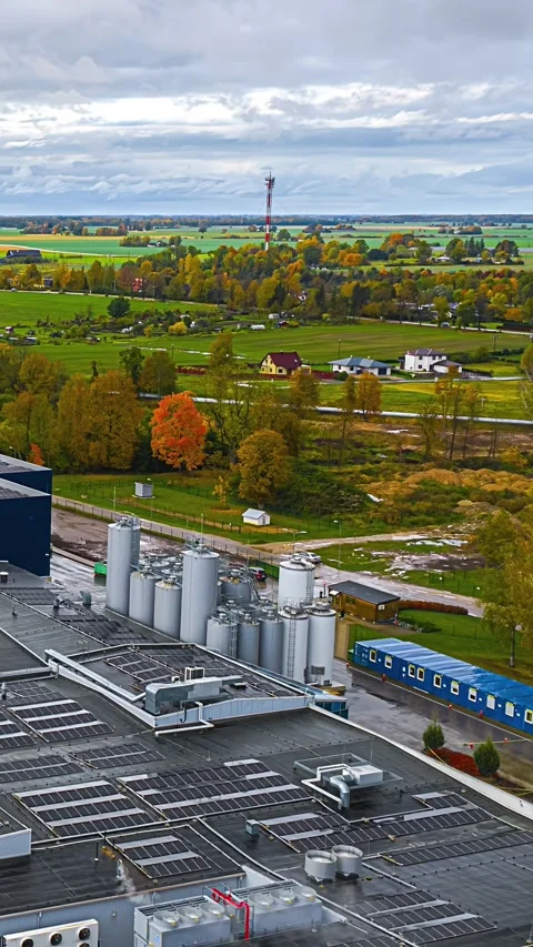 Aerial Vertical Parallax Hyperlapse Over Modern Dairy Factory with Solar Panels Stock Footage 335150605
