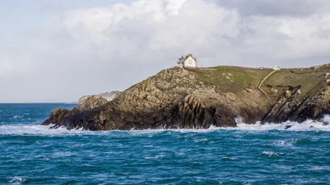 Aerial vertical pointe du millet with waves splashing on cliffs and brittany Stock Footage 131460775
