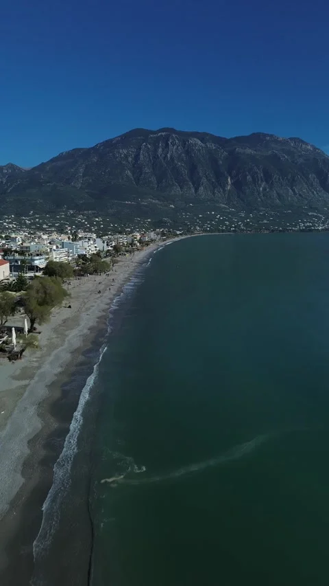 Aerial vertical, push in establishing view of coastline of Kalamata, Kalathi 스톡 동영상 332622410