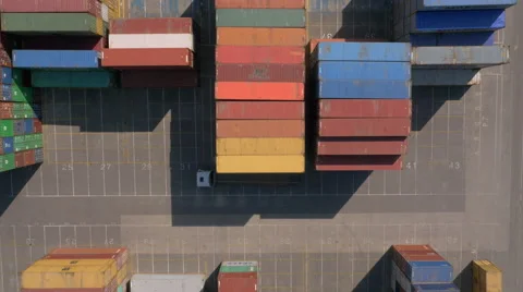 Aerial, vertical - Shipping containers and cargo trucks at port Stock Footage 55583345