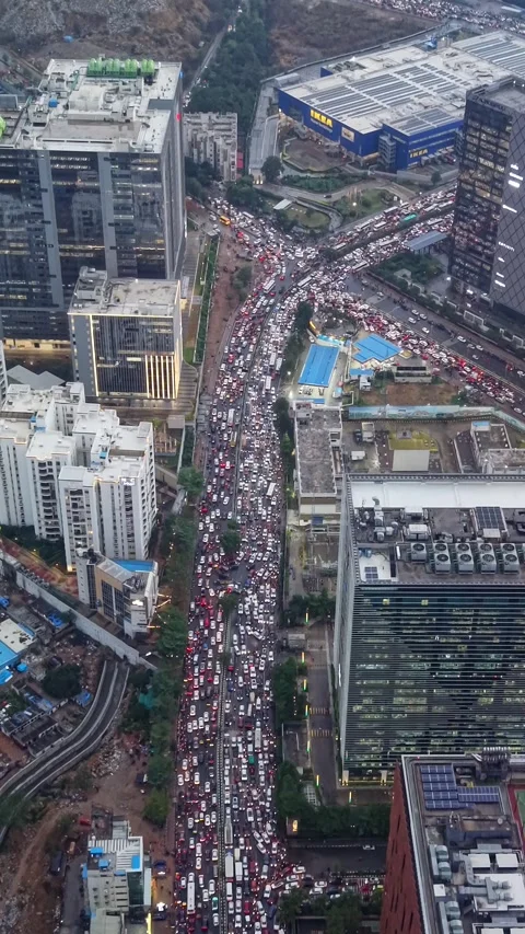 Aerial Vertical shot of traffic Jam at Durgam Cheruvu in Hyderabad, India Stock Footage 340905607
