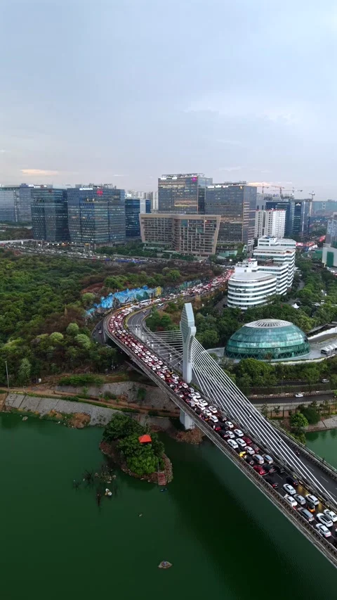 Aerial Vertical shot of traffic Jam at Durgam Cheruvu in Hyderabad, India Stock Footage 340905690