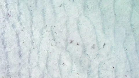 Aerial vertical takeoff over sea waves breaking on sand The Concept of risi.. Stock Footage 346470702