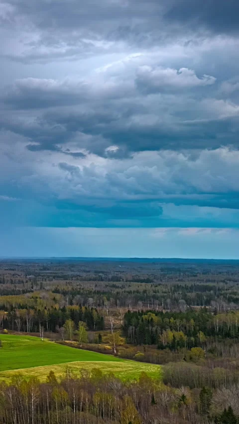 Aerial Vertical Time Lapse Stormy Sky Over Latvian Countryside Fields Spring Stock Footage 337649063