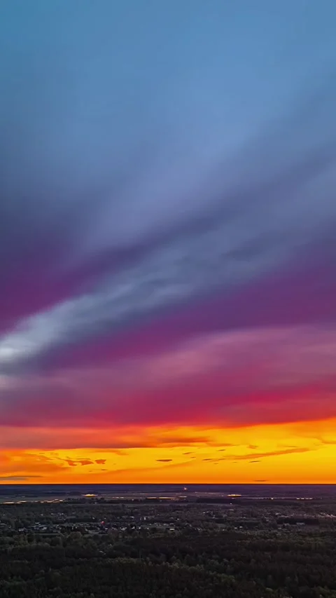 Aerial vertical timelapse of colourful clouds moving over Jelgava city at Video stock 336292254
