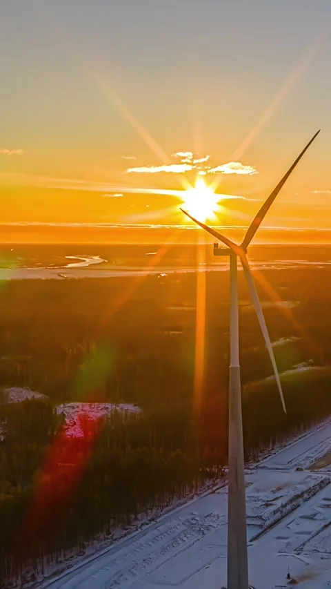 Aerial Vertical Timelapse Single Wind Turbine Rotating Backlit by Starburst Stock Footage 335344078