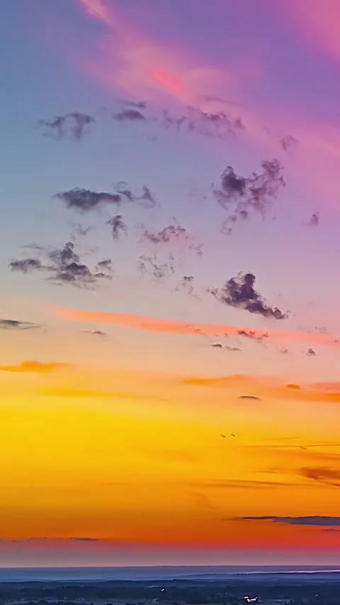 Aerial Vertical Timelapse of Vivid Post-Sunset Sky with Floating Clouds Over Video stock 335347185