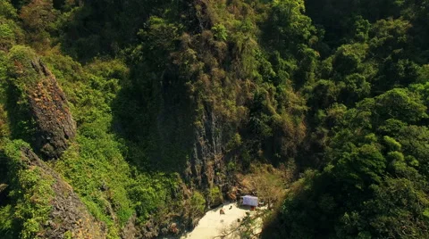Aerial vertical Video of a small beach in a bay between mountains in Thailand. N Stock Footage 63526903