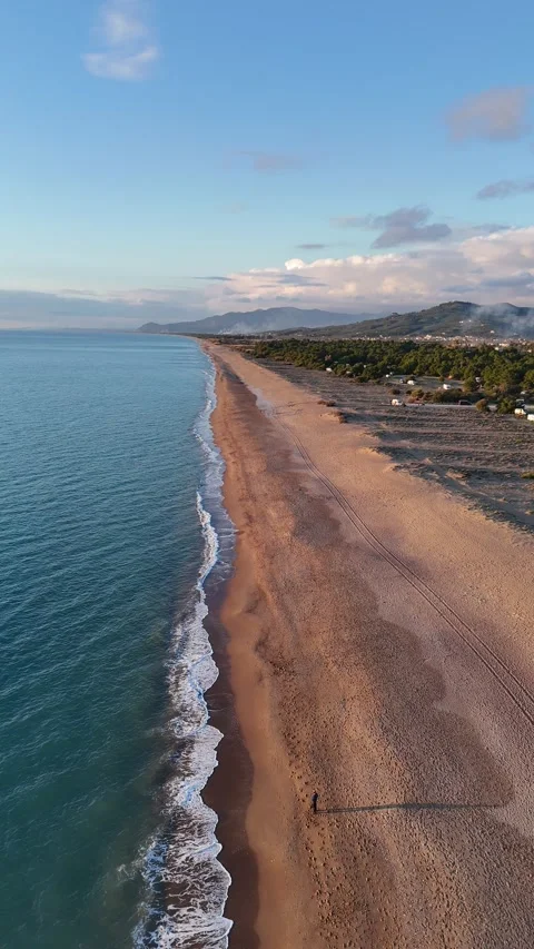 Aerial vertical view of a beautiful sunset at Elea Beach, Greece, a popular camp 스톡 동영상 303301147