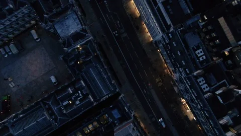 Aerial vertical view of buildings rooftops car driving on the streets of London Stock Footage 125997371