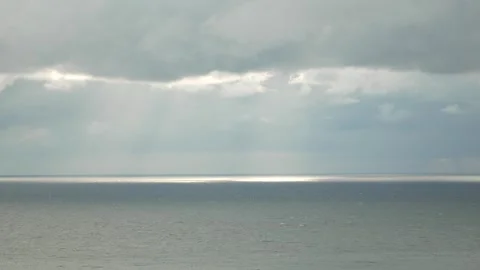 Aerial vertical view. Dramatic moody and gloomy rain clouds over sea. Abstract Stock Footage 271621241