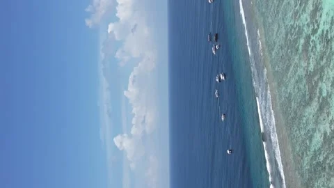 Aerial vertical view of large turquoise clear lagoon between Lux south Ari Stock-Footage 244704840