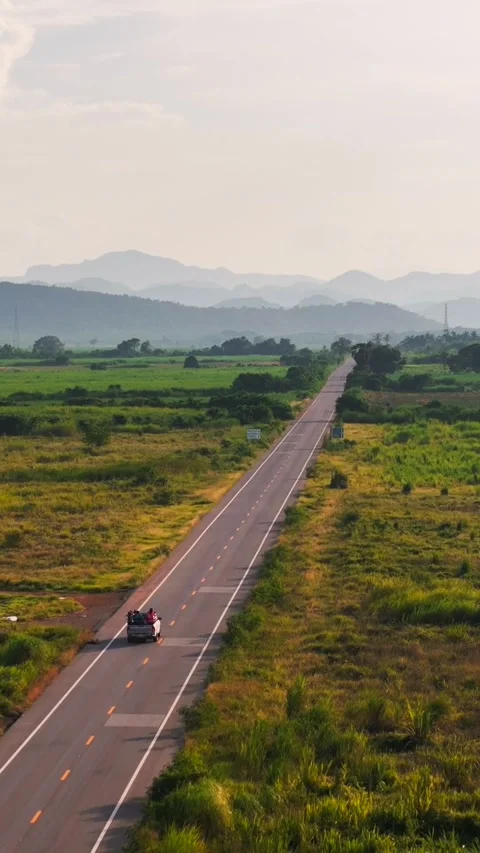 Aerial Vertical view of Loaded Pickup Truck Driving Along Countryside Road Stock Footage 318462092