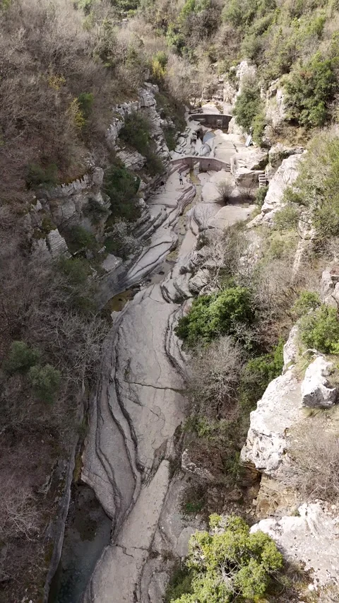 Aerial vertical View of Moss Covered Rock Pools and Gorge in Papingo Greece Video stock 307316509