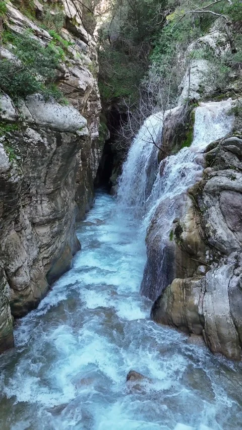 Aerial Vertical View of Neda Waterfall and Neda river on a Sunny Day, Greece Video stock 304113305