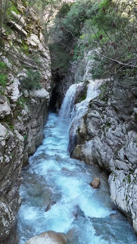Aerial Vertical View of Neda Waterfall and Neda river on a Sunny Day, Greece Video stock 304113312