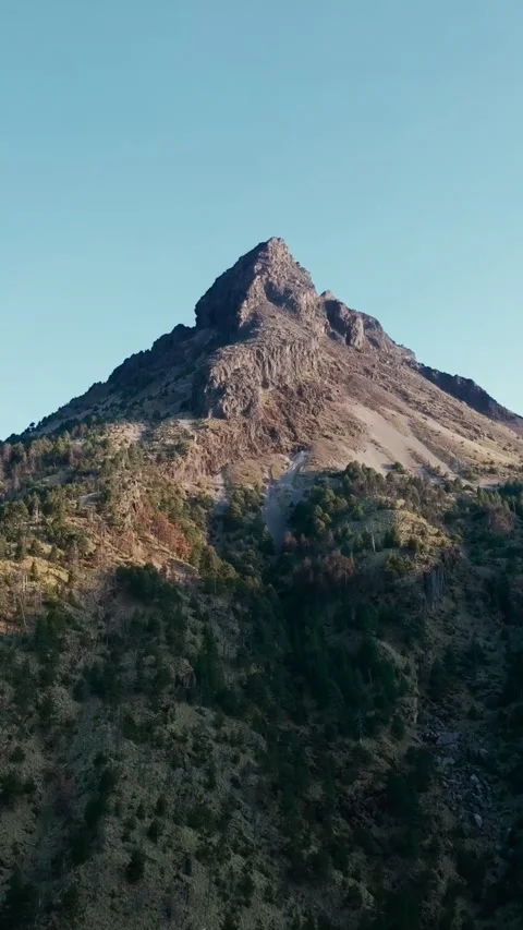 Aerial Vertical View of Nevado de Colima Volcano Peak in Morning Light – Mobile Stock Footage 345295139
