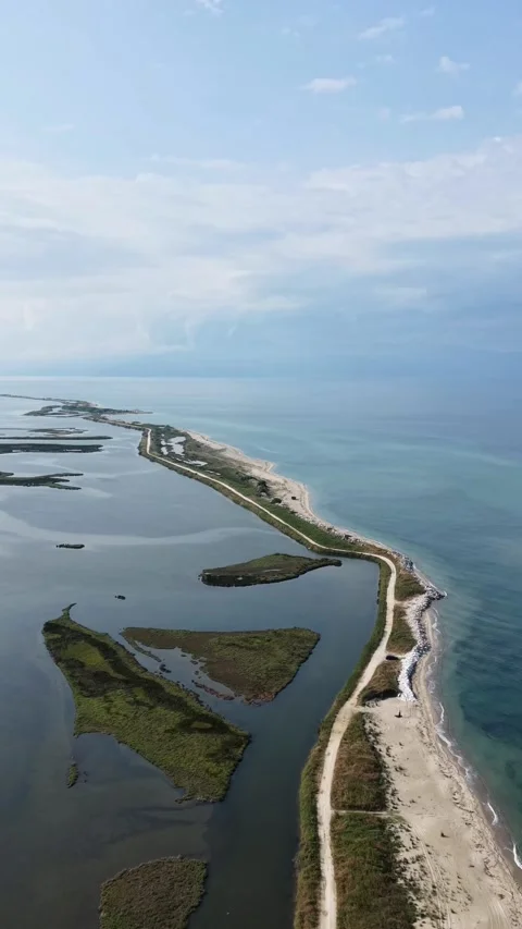 Aerial Vertical View of Sand Spit and Turquoise Sea Lagoon in Greece Stock Footage 341385608