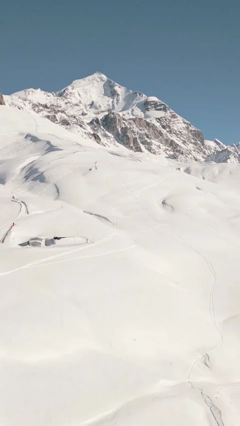 Aerial vertical view of snow covered Mount Tetnuldi peak in Svaneti, Georgi.. Stock Footage 324968755