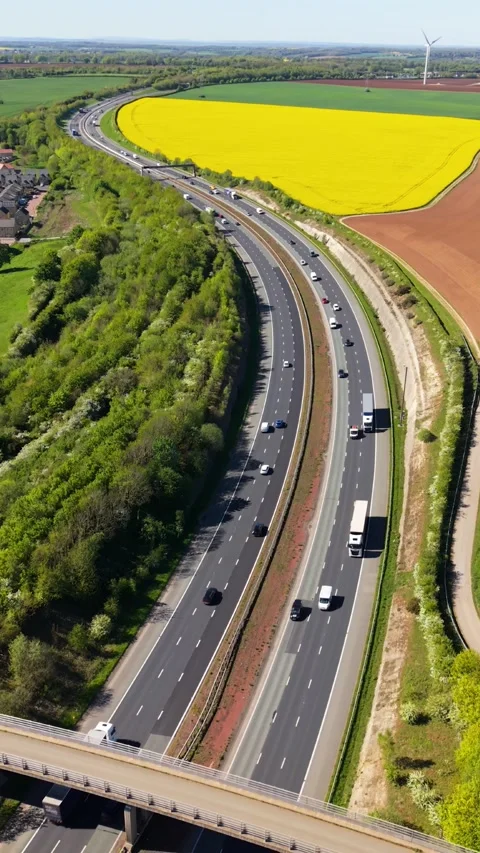 Aerial vertical view of speeding traffic on motorway with downward camera motion Stock Footage 340168316