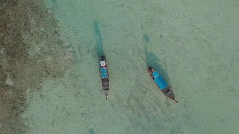 Aerial video above two longtail boats on Laem Tong, Part Of Phi Phi Island. Stock Footage 93086598