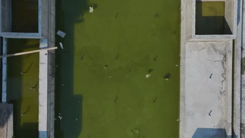 Aerial Video Aerial View of Construction Workers and a Crane Loading Materials Stock Footage 300992753