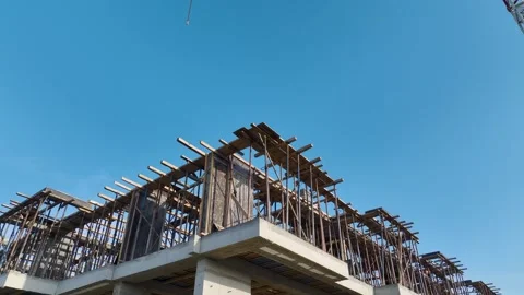 Aerial Video Aerial view of workers preparing a floor slab, handling metal Stock Footage 343901165