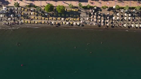 Aerial Video beach umbrellas pattern and sea Turkey aerial Stock Footage 341292156