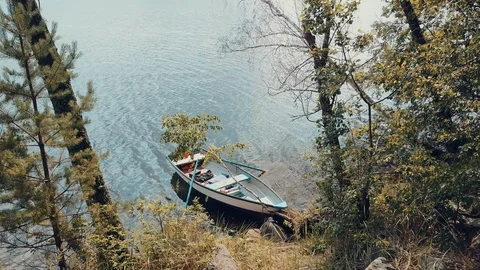 Aerial video of boat floating on the water, flight between the trees Stock Footage 93066053