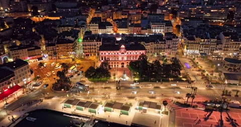 Aerial video in Cannes with a view of the beach and luxurious buildings at Night Stock Footage 308388975