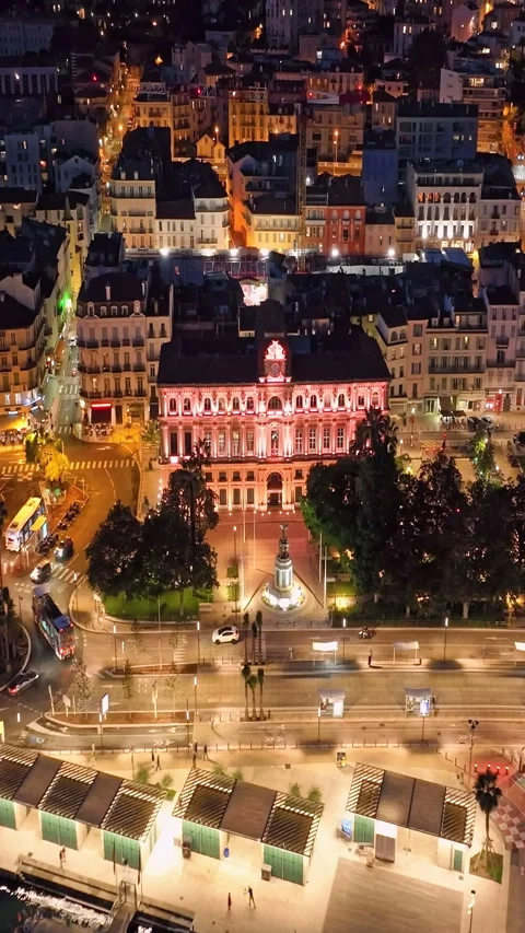 Aerial video in Cannes with a view of the beach and luxurious buildings at Stock Footage 318955545