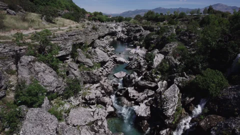Aerial video of the Chibna River flowing swiftly through rock outcrops in Stock Footage 275199684