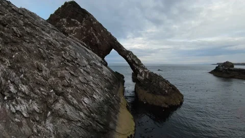 Aerial video of cliffs and rocks in the sea, Scotland Stock Footage 240053791