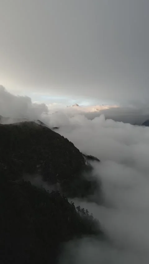 Aerial video of clouds in the background of peaks in the Himalayas Stock Footage 261620231