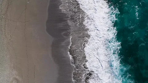 Aerial Video Coastal Waves Breaking on Beach Texture Stock Footage 341387216