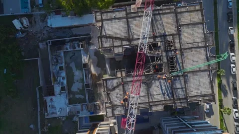 Aerial Video of a Construction Project With Cranes Moving Concrete Blocks and Stock Footage 301366204