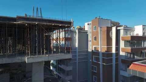 Aerial Video: Construction Work in Full Swing With Cranes Lifting Materials and 库存影片 342486907