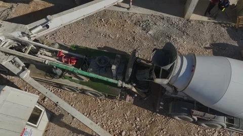 Aerial Video: Construction Workers Completing Concrete Floors and Cranes Stock Footage 342513212