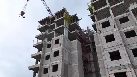 Aerial Video Construction workers use professional tools to spread and level Stock Footage 343905764