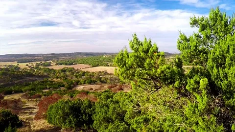 Aerial Video Descending on Men and Women Hiking Hill Country Stock Footage 78984553