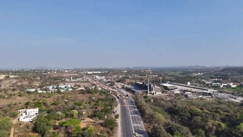 Aerial video of Developing India: Road Infrastructure Factories Corporate Stock Footage 313279797