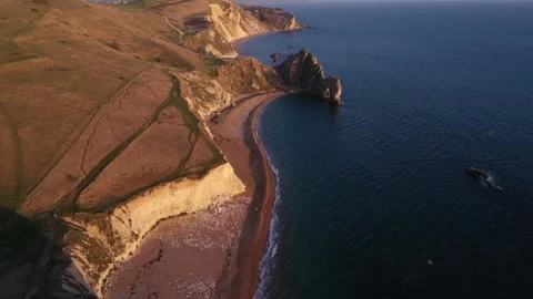 Aerial video of the Dordal Dor beach at sunrise, Dorset, England Stock Footage 250543653