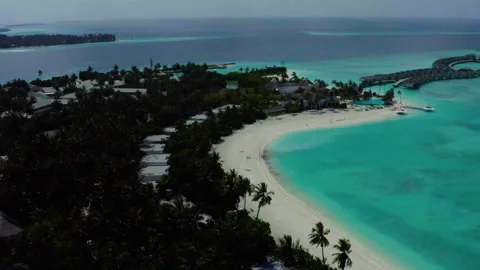 Aerial video of a drone flying over a picturesque beach Stock Footage 243085199