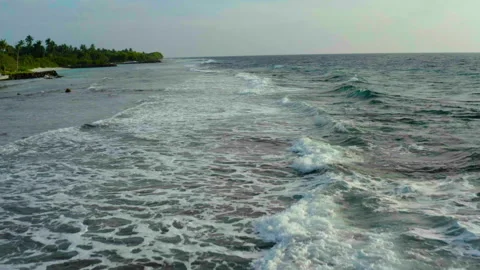 Aerial video of a drone flying over a picturesque beach Stock Footage 243089959