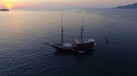 Aerial Video. The drone revolves around a sailboat at sea. N. Stock Footage 63114338