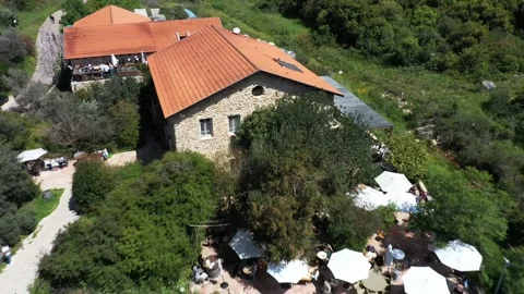 Aerial video of an event complex surrounded by green vegetation, in northern Stock Footage 247652736