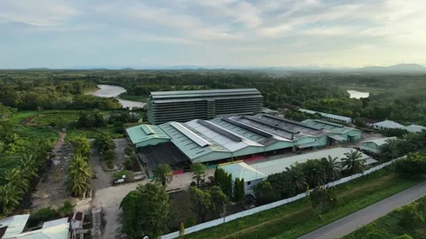 Aerial video of a factory complex surrounded by greenery Stock Footage 333130602