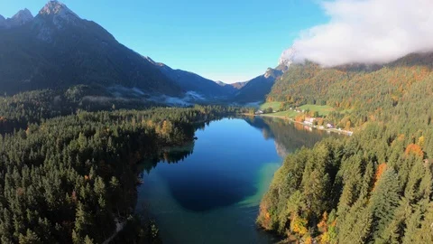 Aerial video of Fall foliage surrounding beautiful mountain lake Stock Footage 99387527