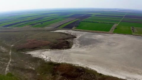 Aerial video of fields and large lake in summer in nature reserve Slano Kopovo Stock Footage 270501902
