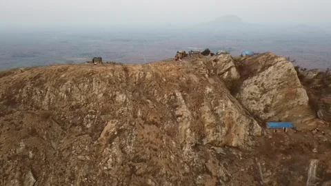 Aerial video flying back over a mountain peak in Malawi Stock Footage 240906360